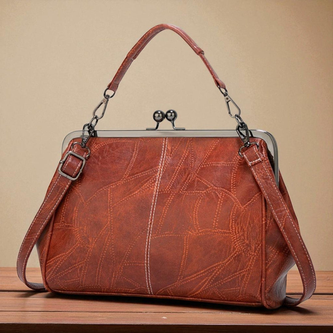 Vintage handbag with clasp closure