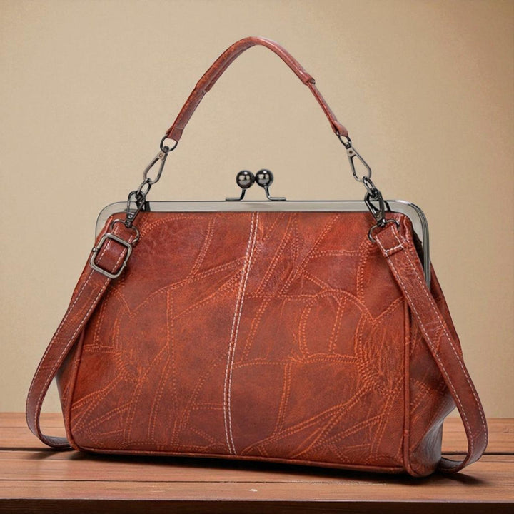 Vintage handbag with clasp closure