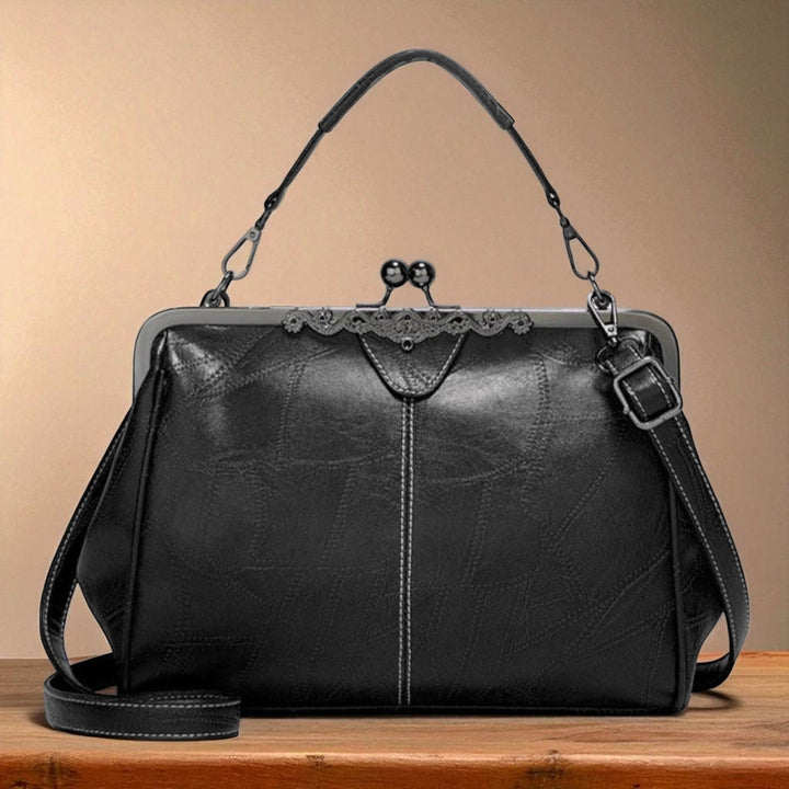 Vintage handbag with clasp closure