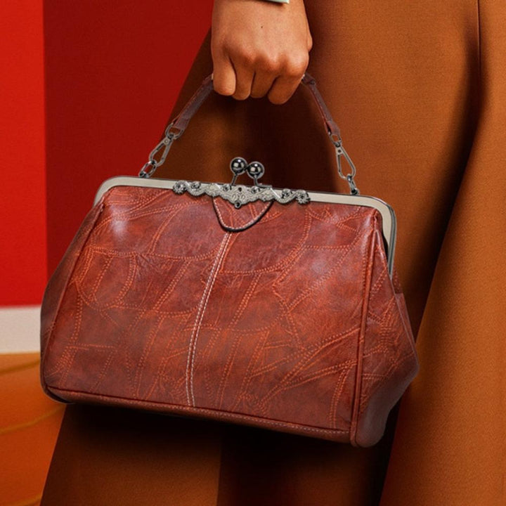 Vintage handbag with clasp closure