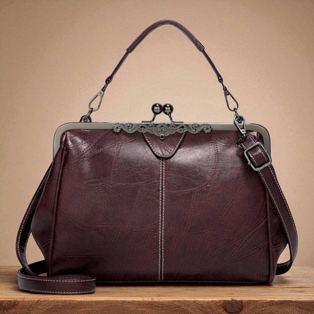 Vintage handbag with clasp closure
